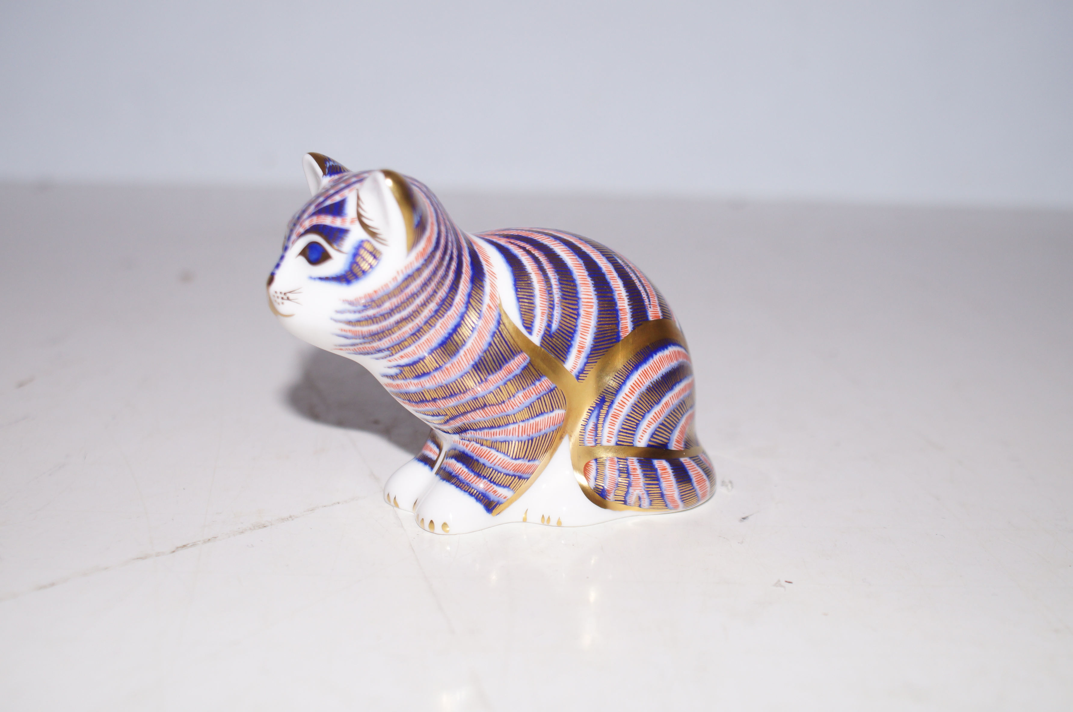 Royal Crown Derby Sitting kitten with gold stopper