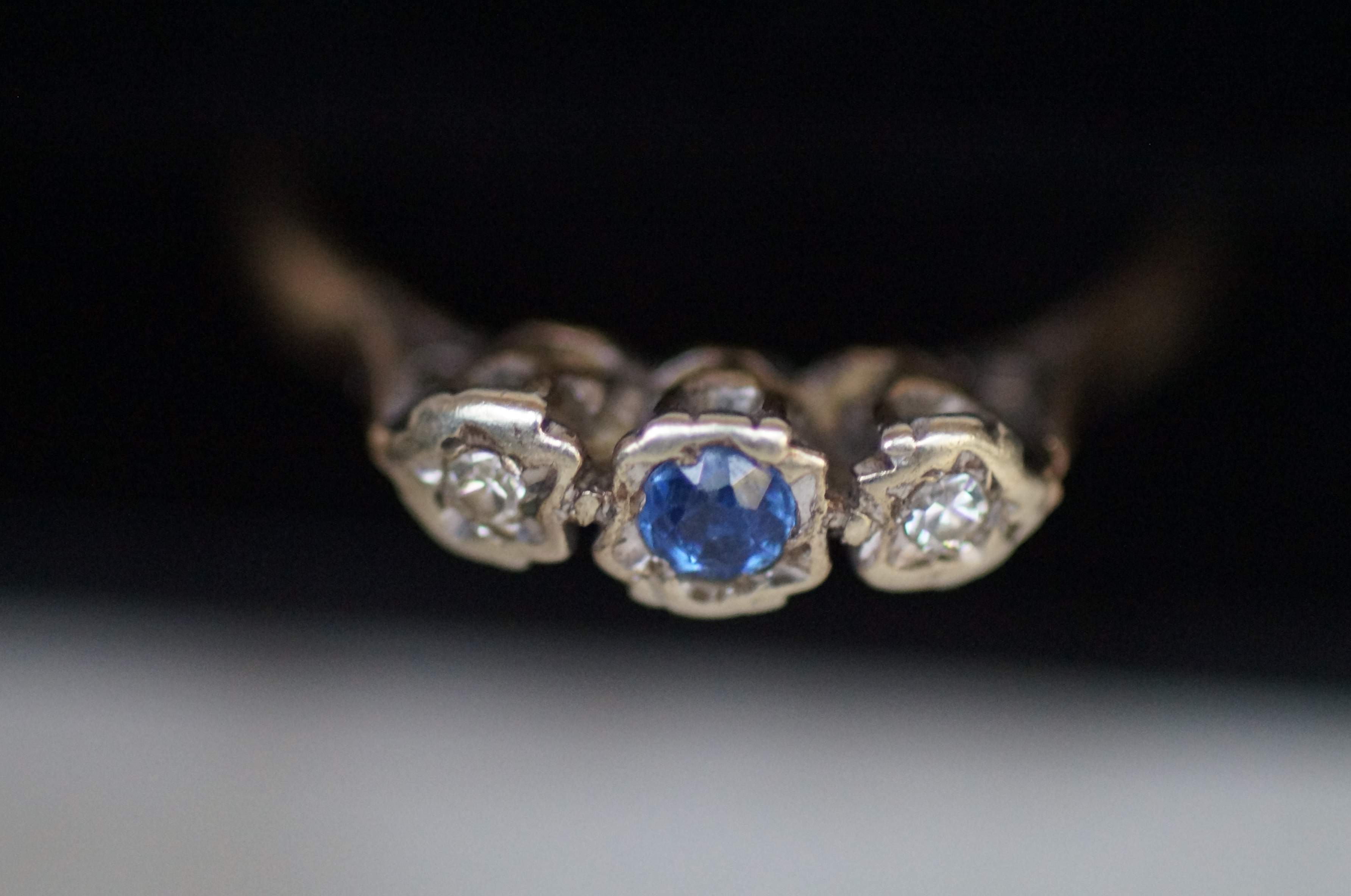 9ct gold ring set with 2 diamonds and one blue sto