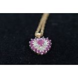 9ct gold chain with diamond and pink stone pendant
