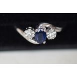 9ct white gold ring set with diamonds and sapphire