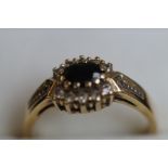 9ct gold ring set with sapphire and diamonds