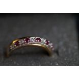 9ct gold ring set with ruby's and diamonds