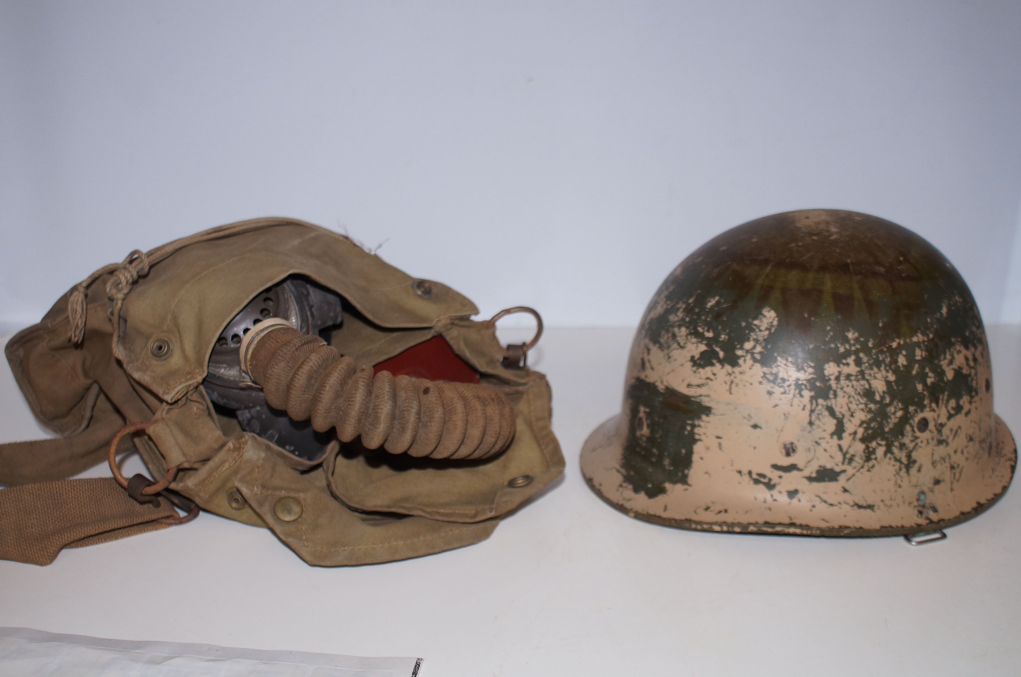 Military Helmet together with a Gas Mask in Canvas