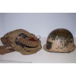 Military Helmet together with a Gas Mask in Canvas