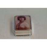 Silver pill box depicting a nude lady in the ename