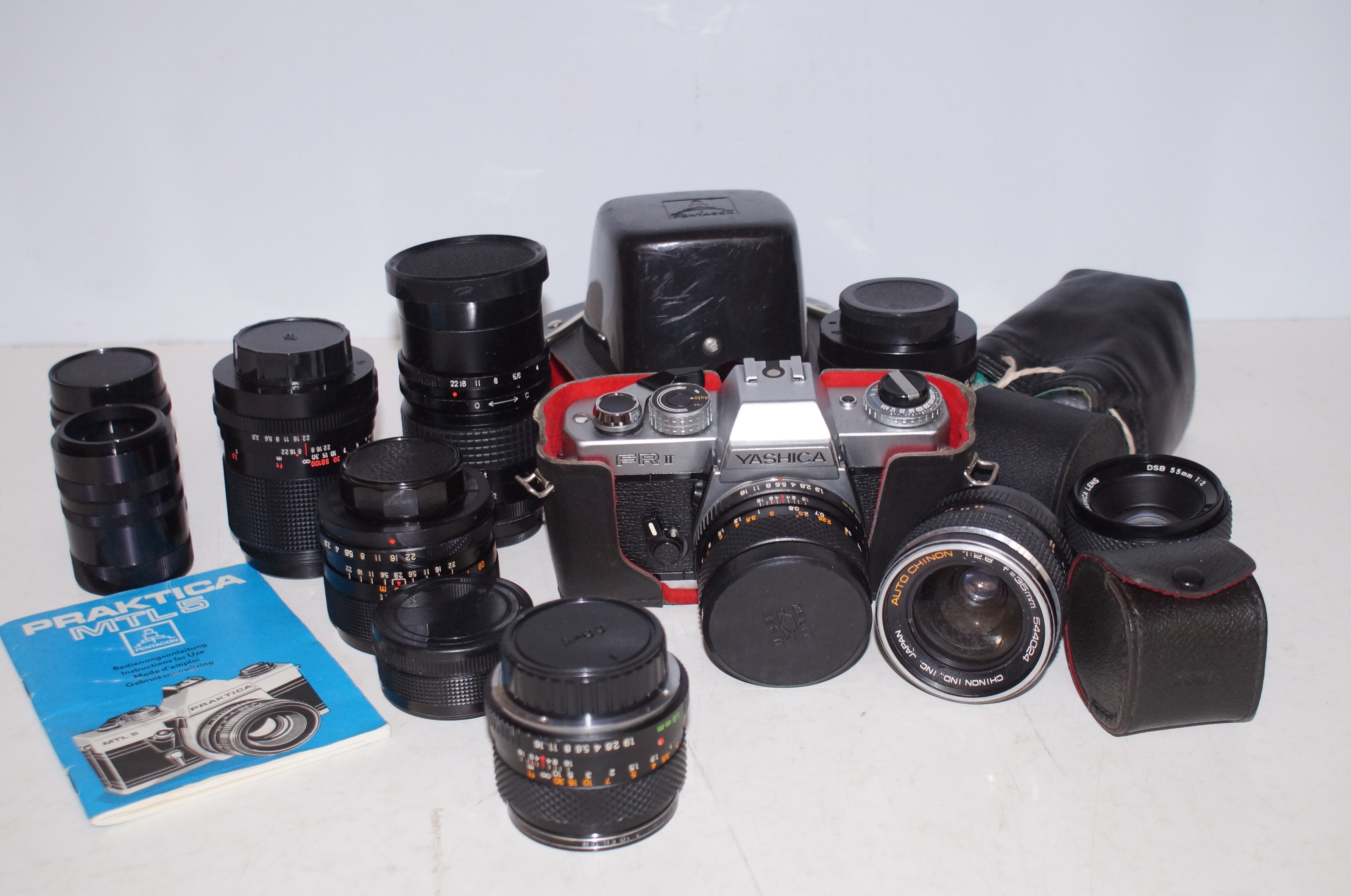 Yashica Camera with a Collection of Lenses