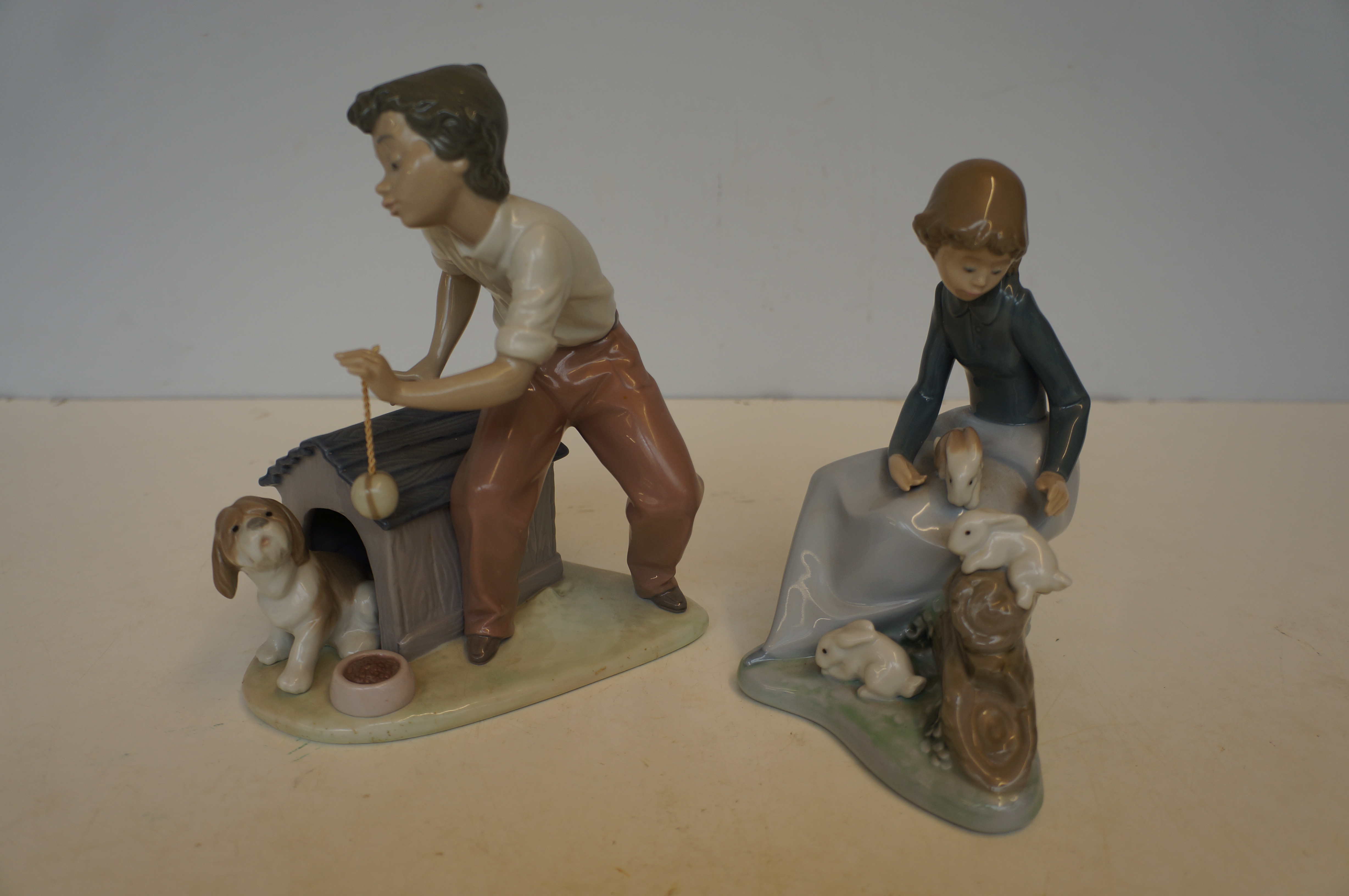 Lladro Figurine 'Boy with Pup' together with a Nao