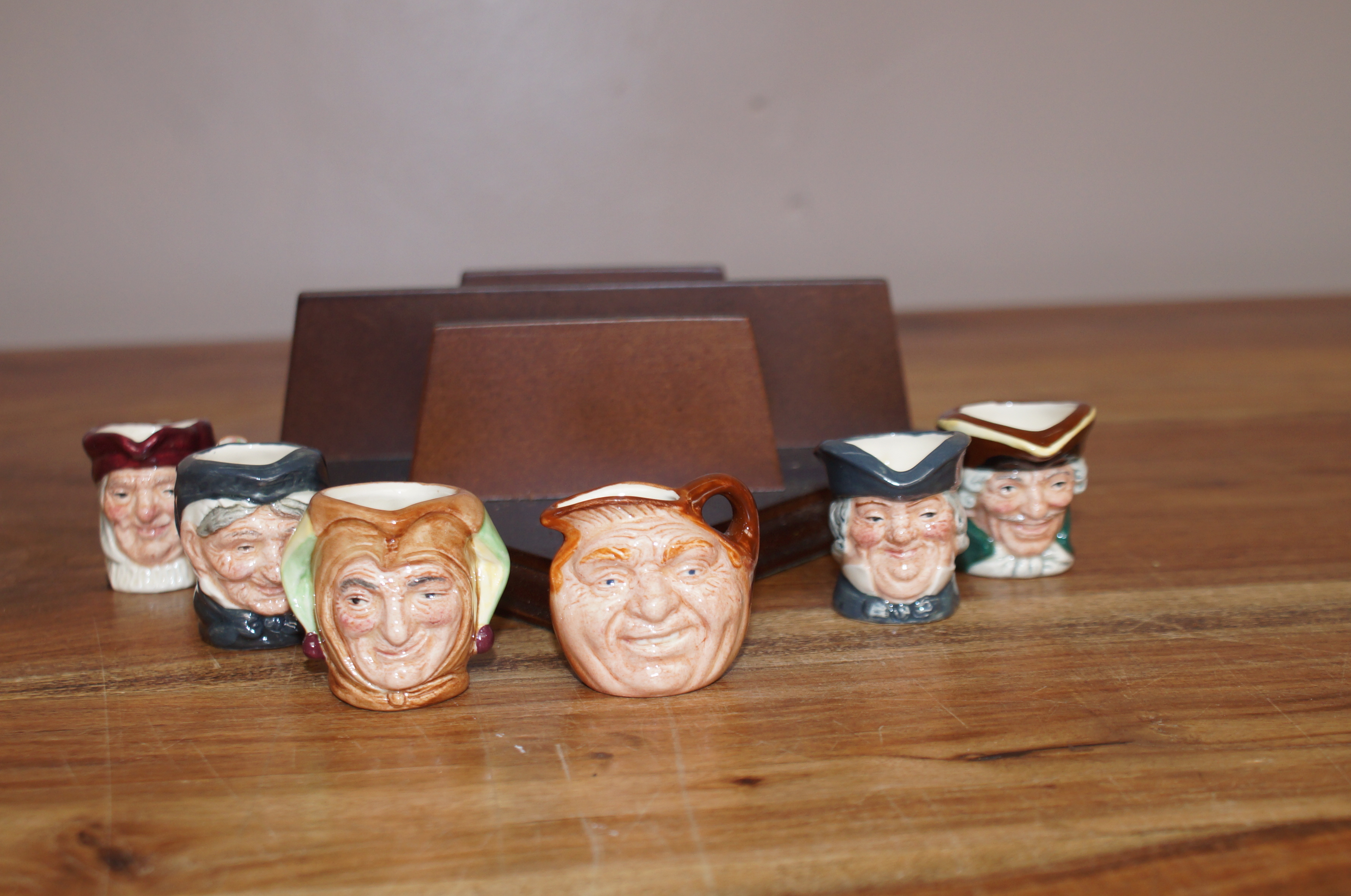 6 Miniature Royal Doulton Tobies on Shelf