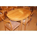 A Greaves & Thomas teak extending dining table and