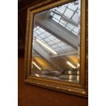 A gilt framed bevelled mirror 77x65 cm