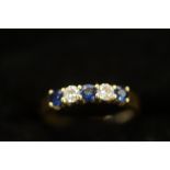 18ct Gold ring set with 3 sapphire and 2 diamonds