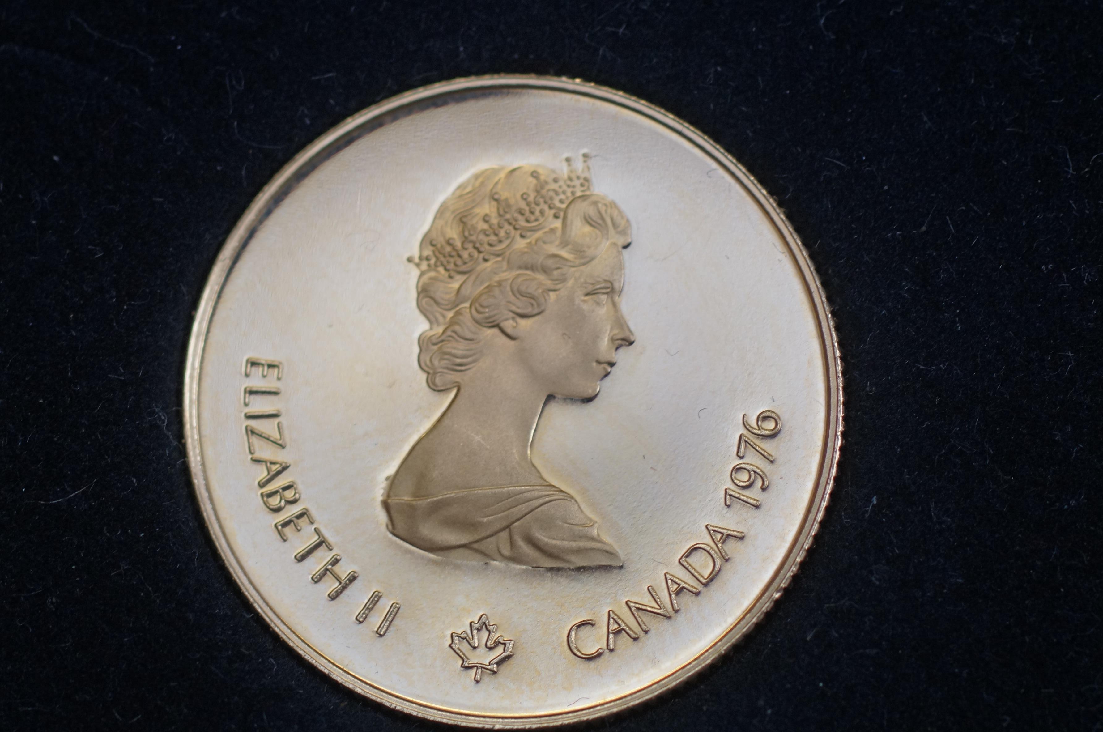 14ct gold - $100 Canadian 1976 coin. 16.8 grams wi