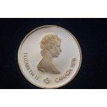 14ct gold - $100 Canadian 1976 coin. 16.8 grams wi