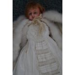 A rare Victorian wax headed doll, split to forehea