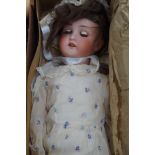 An Edwardian bisque head doll in original box 25"