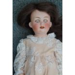 Bisque headed doll on a rare snow drop marked body