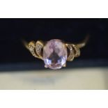 9ct Gold ring set with light purple stone & diamonds