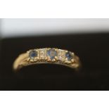 9ct Gold ring set with blue topaz & diamonds