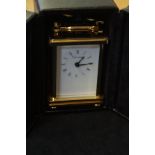Brass Churchill carriage clock & key in leather bo