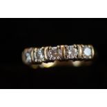 9ct Gold ring set with 5 white gem stone Size O