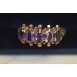 9ct Gold ring set with 5 purple stones