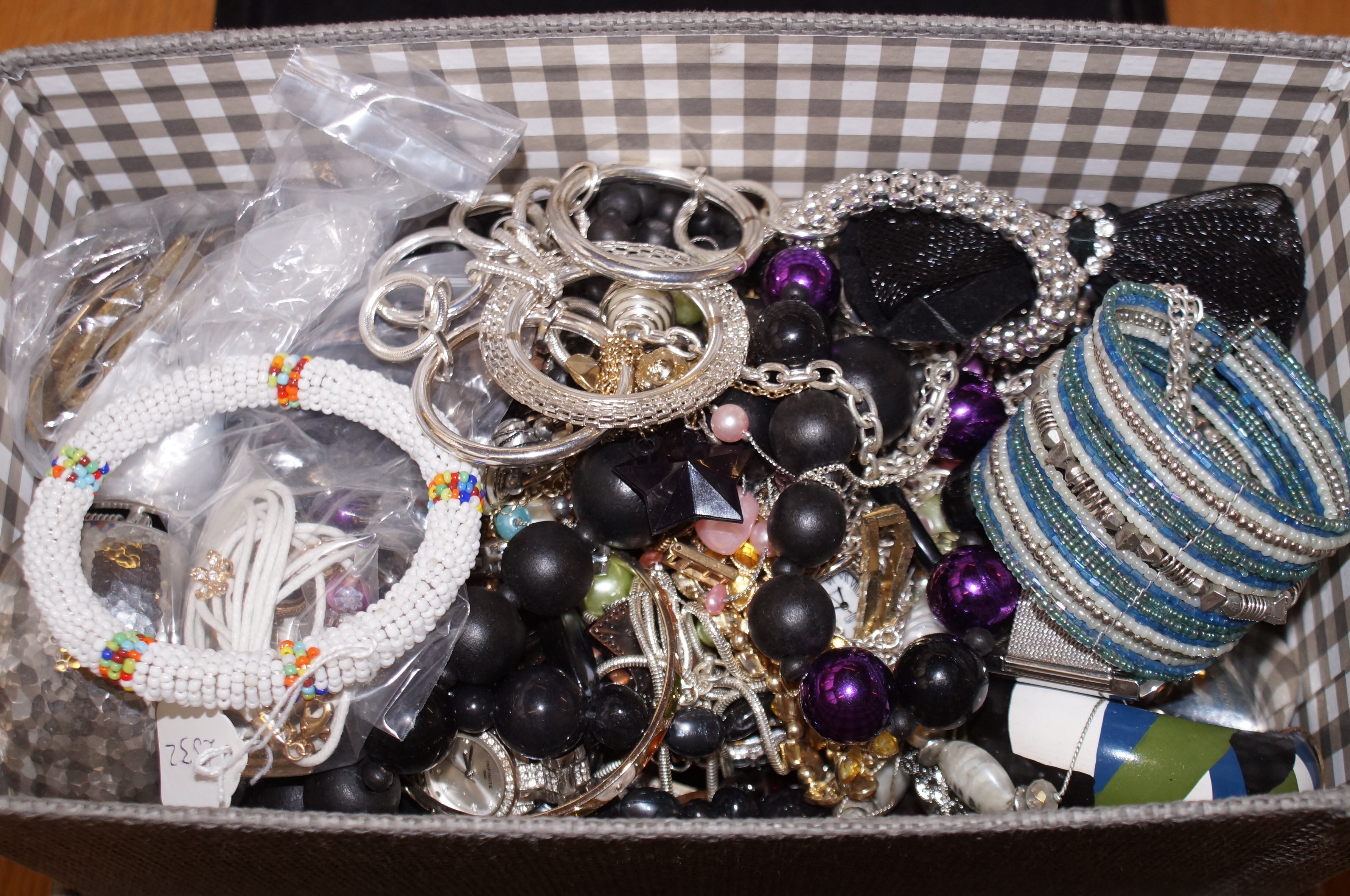 Large box of unsorted costume jewellery