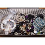 Large box of unsorted costume jewellery