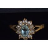 9ct Gold ring set with light blue stone