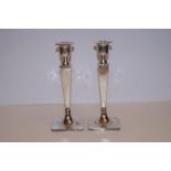 A pair of silver Walker & Hall candle sticks, date