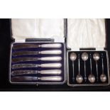 Cased set of silver butter knives together with a