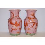 Pair of large oriental vases depicting dragons