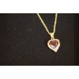 9ct gold chain and pendant set with Diamonds and g