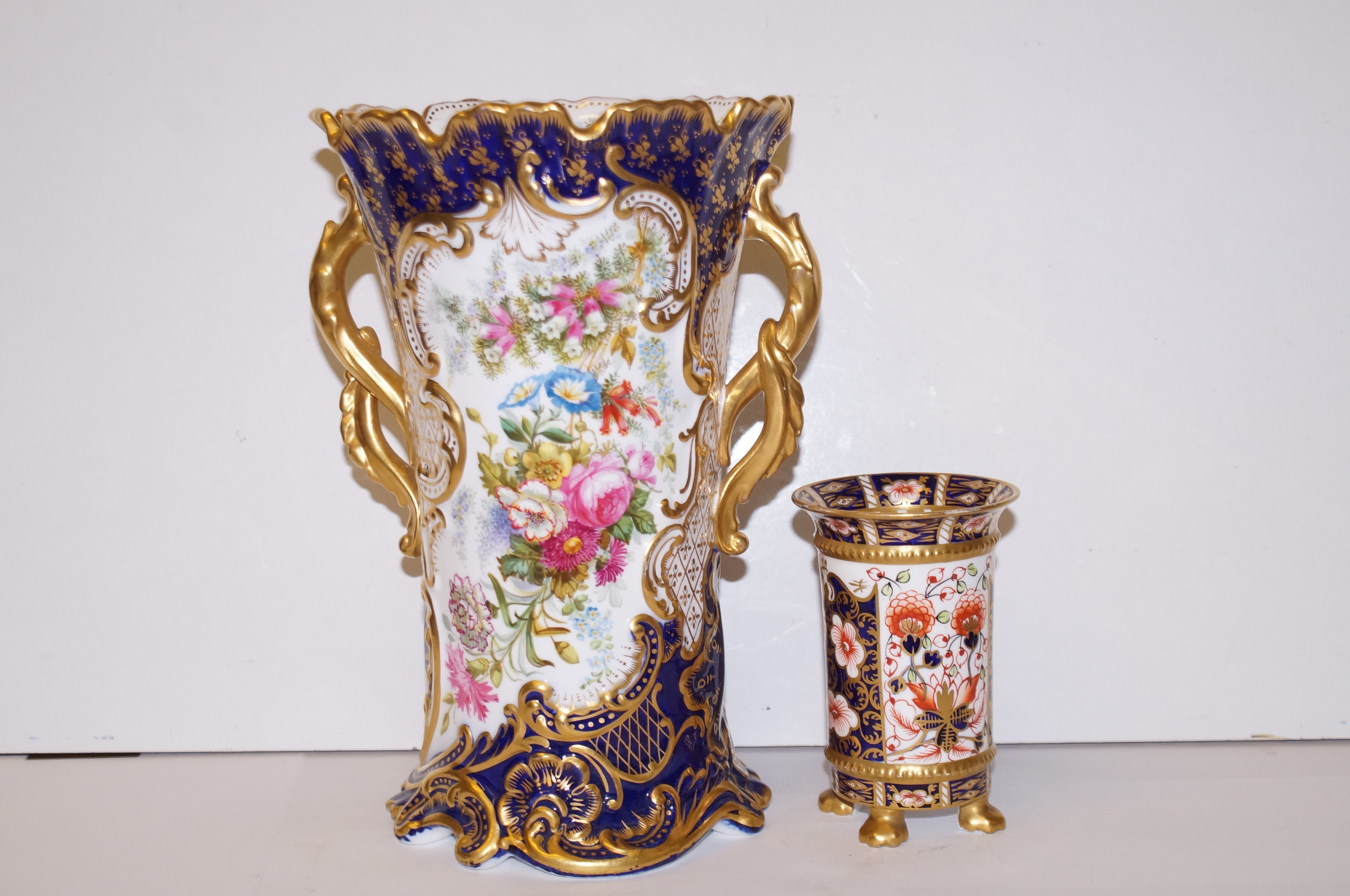 An early Royal crown derby four footed vase togeth