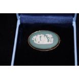 Boxed Wedgwood green & white oval brooch