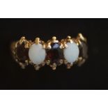 9ct Gold ring set with opals & garnets