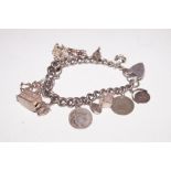 Silver charm bracelet with 14 charms
