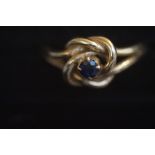 9ct Gold knot ring with sapphire