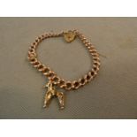 9ct Gold bracelet with heart lock & 1 charm. Weigh