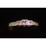 9ct Gold ring set with diamond & pink sapphires Si