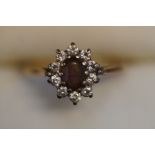 9ct Gold ring set with cz & central garnet Size M