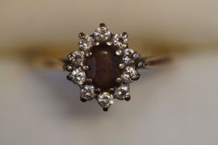 9ct Gold ring set with cz & central garnet Size M