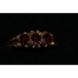 9ct Gold ring set with 3 garnets