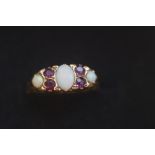 9ct Gold ring set with opals & rubies