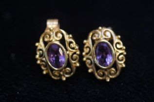 Pair of 9ct Gold earrings set with amethyst