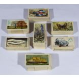 A collection of assorted cigarette cards