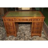 A pedestal desk with green leather insert, 4' wide x 2' deep and 2'6" tall