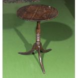 A small oak tilt top table