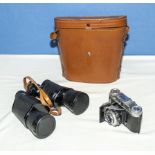 A pair of binoculars Super Zenith 16 X 50 and a Voigtlander VITO II 35mm camera