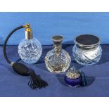 Two cut glass perfume atomisers, a perfume bottle and a lidded jar