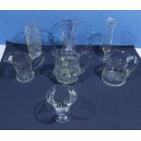 A collection of glass jugs and vases